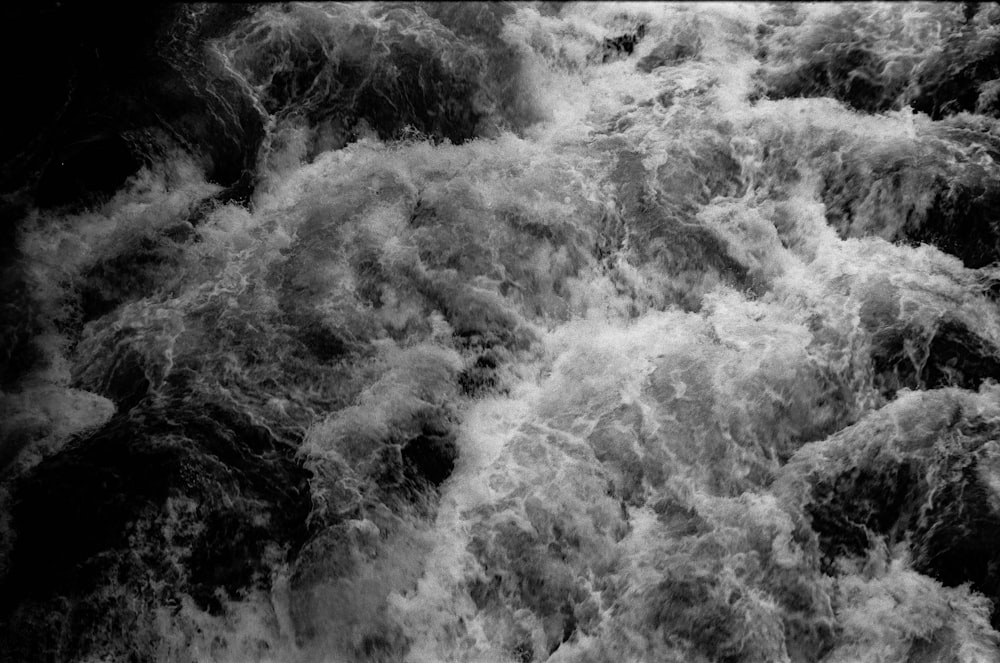 grayscale photo of water waves