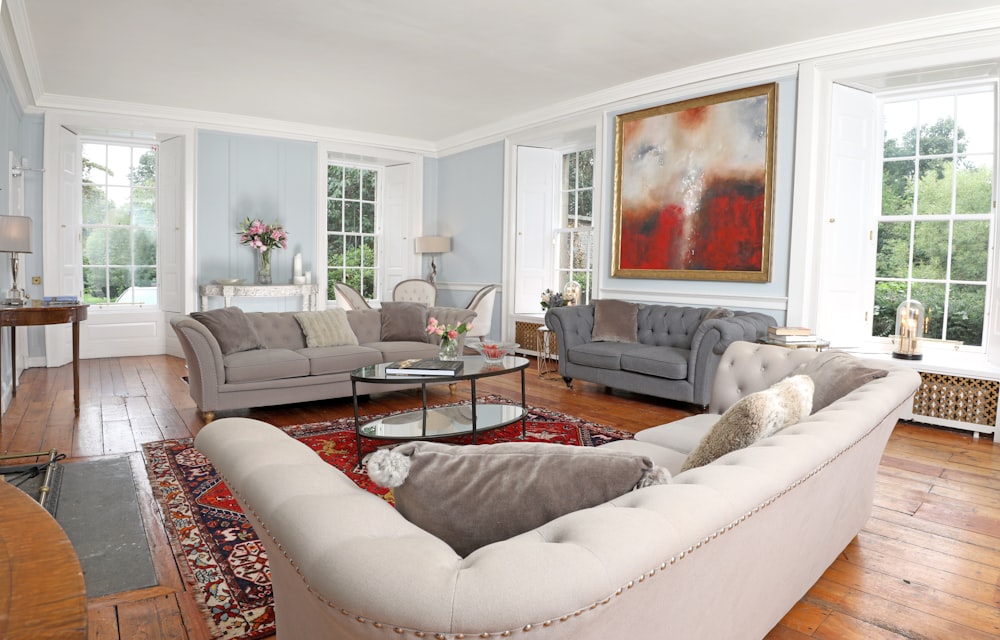 white and brown throw pillows on white couch