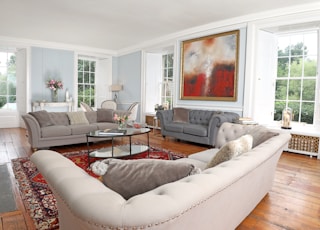 white and brown throw pillows on white couch