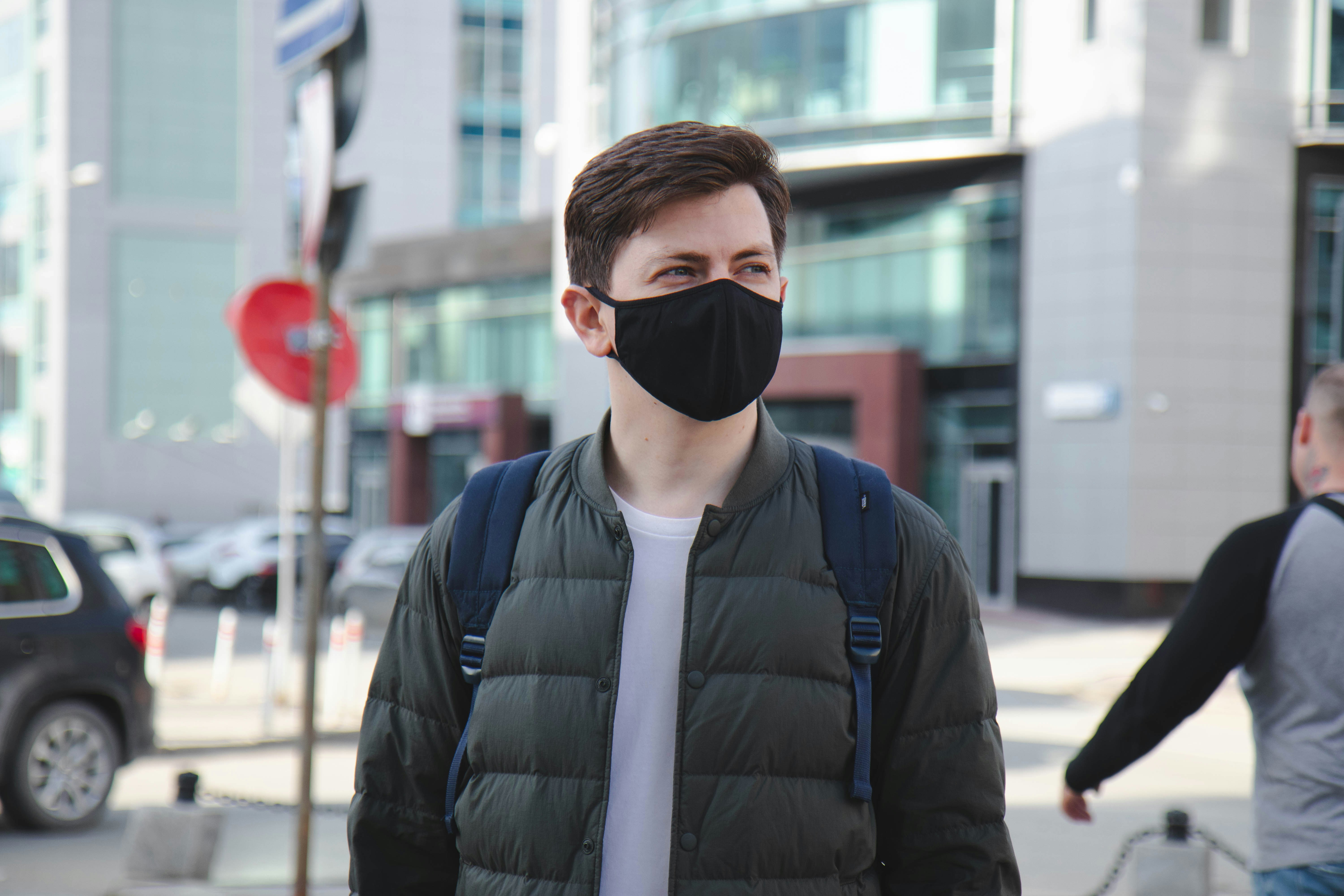 man in black jacket wearing black sunglasses