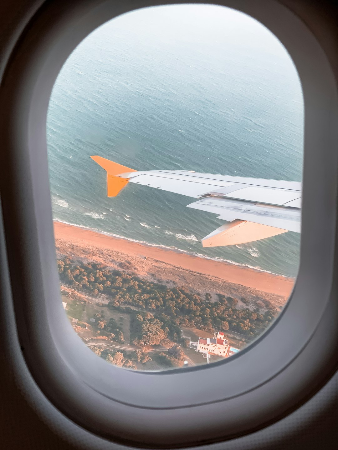 airplane window view of white clouds during daytime