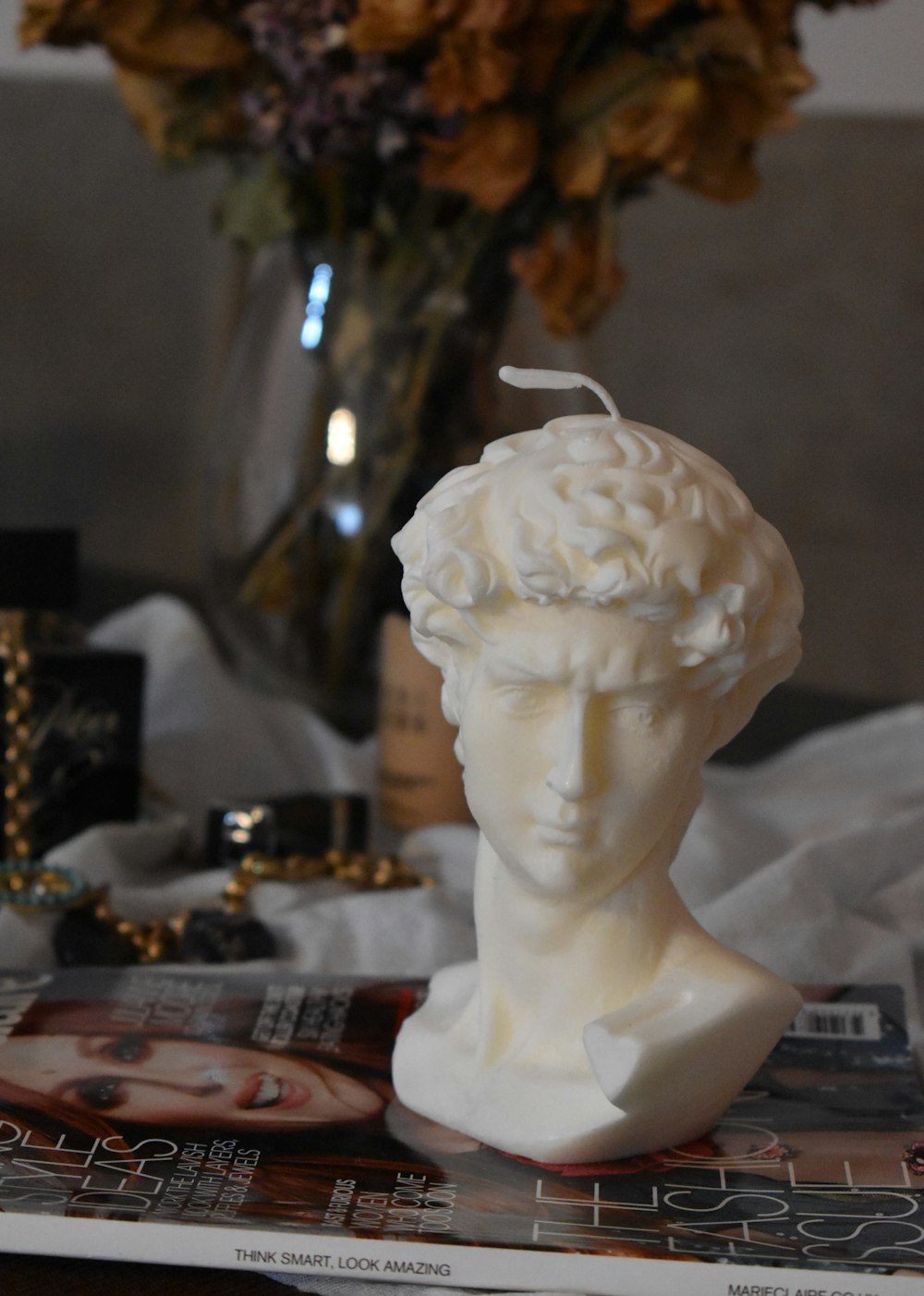 white ceramic figurine on table