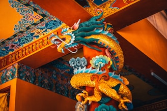 blue dragon figurine on brown wooden table