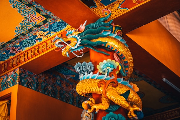 blue dragon figurine on brown wooden table