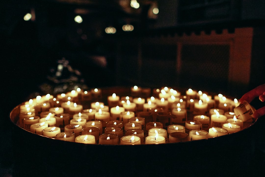 lighted candles on brown wooden table