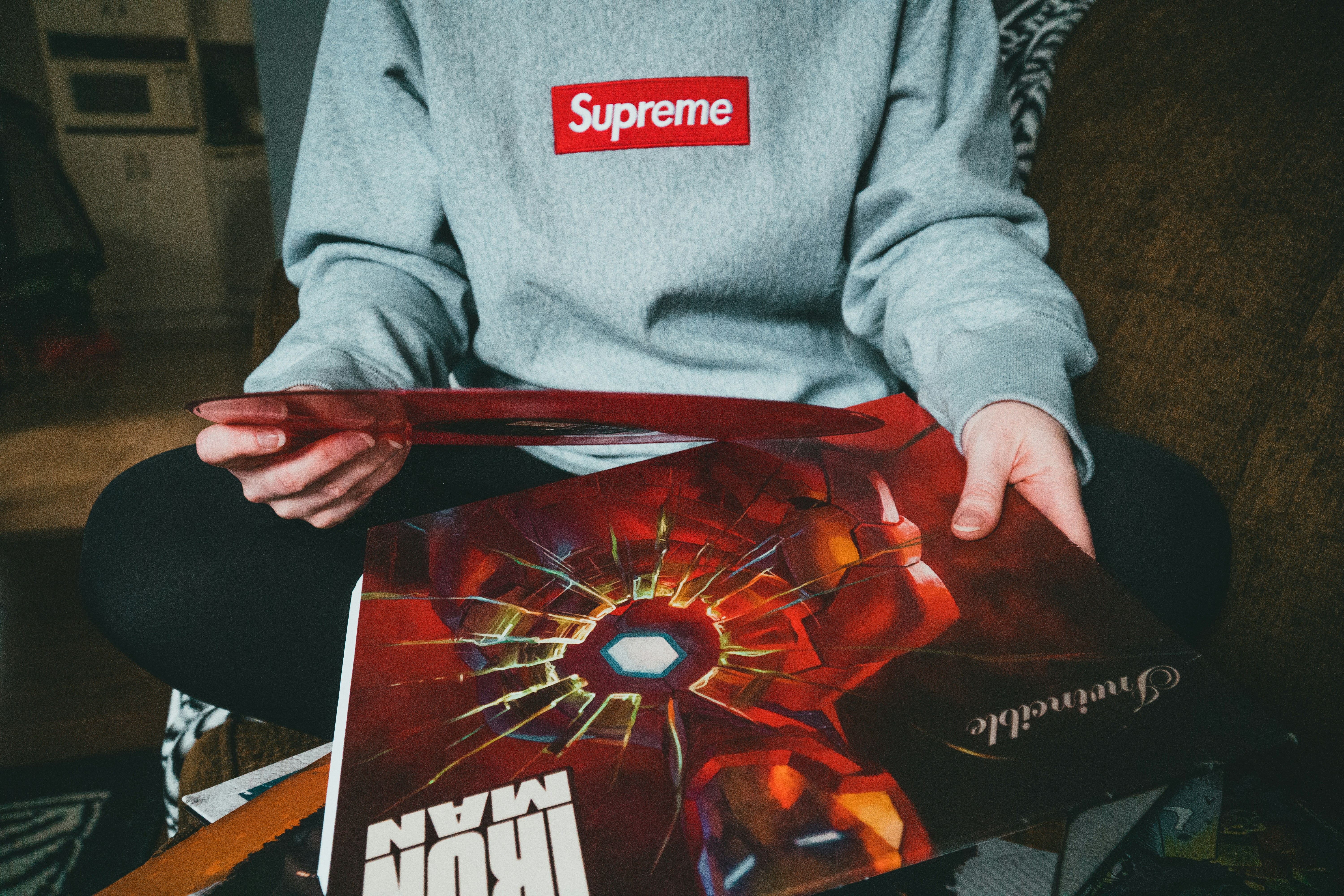 person holding red and black book