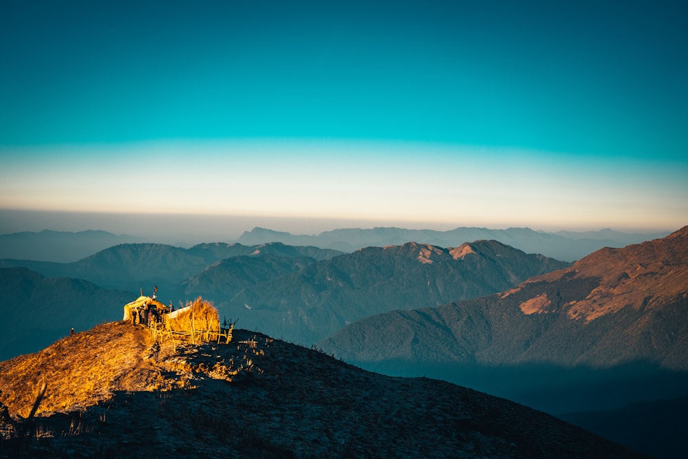 brown rocky mountain under blue sky during daytime