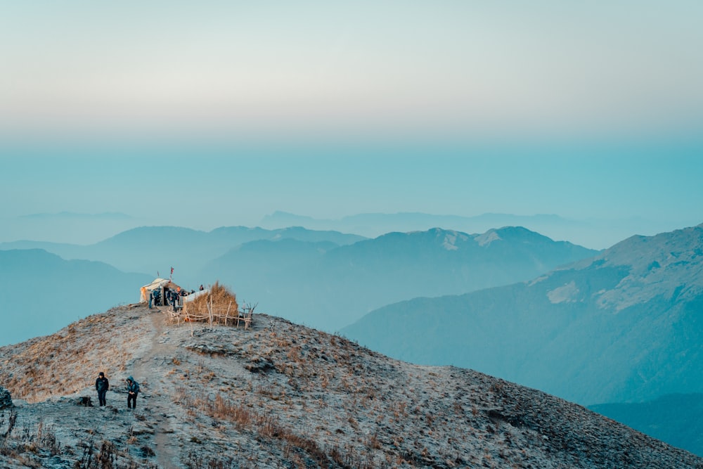 people walking on rocky mountain during daytime