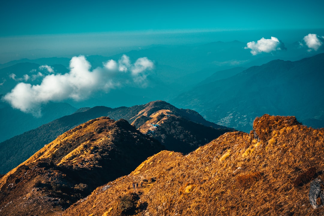 brown mountain under blue sky during daytime