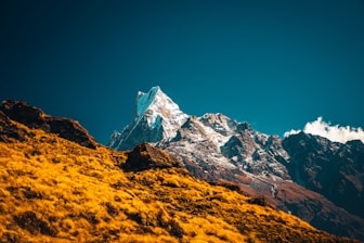 brown and white rocky mountain under blue sky during daytime