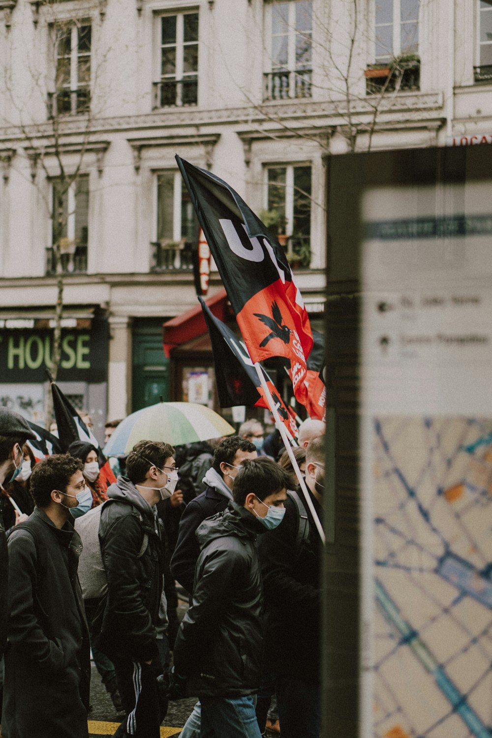 people holding flags during daytime