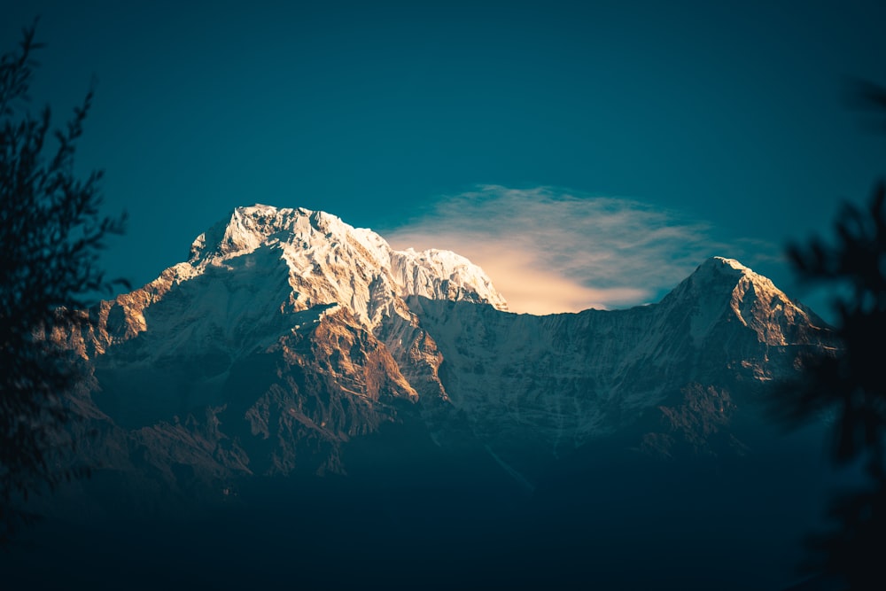 snow covered mountain under blue sky during daytime