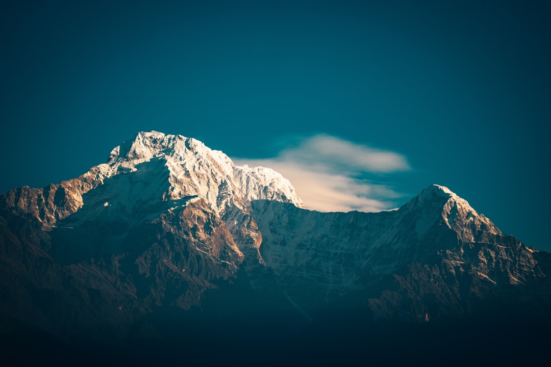 snow covered mountain under blue sky during daytime