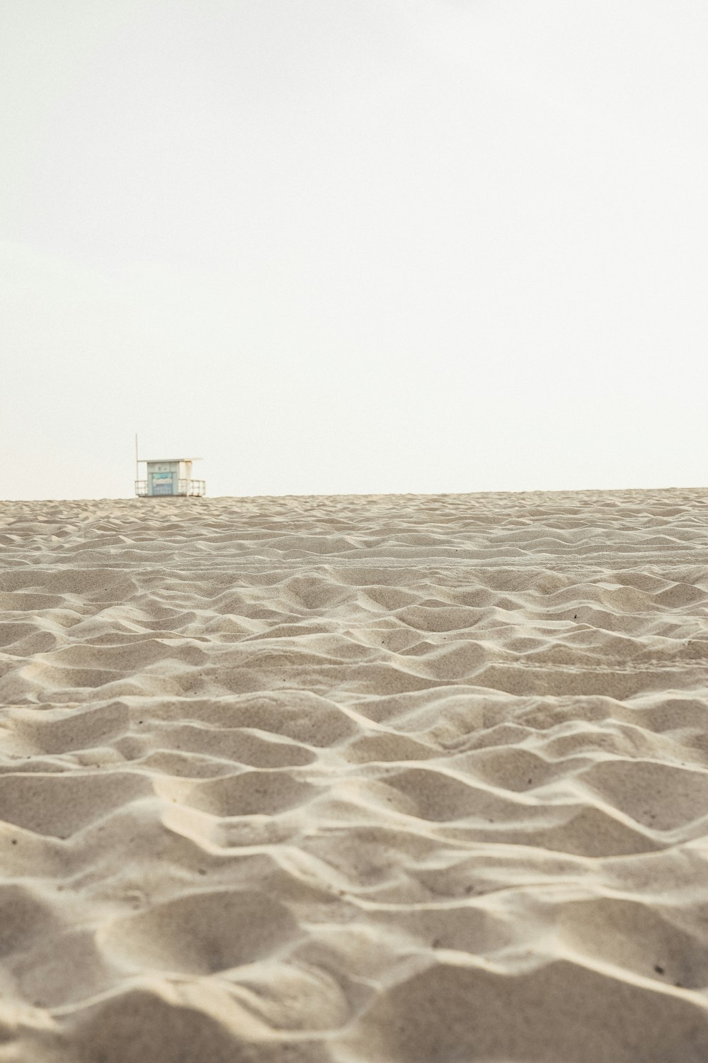 brown sand under dark sky