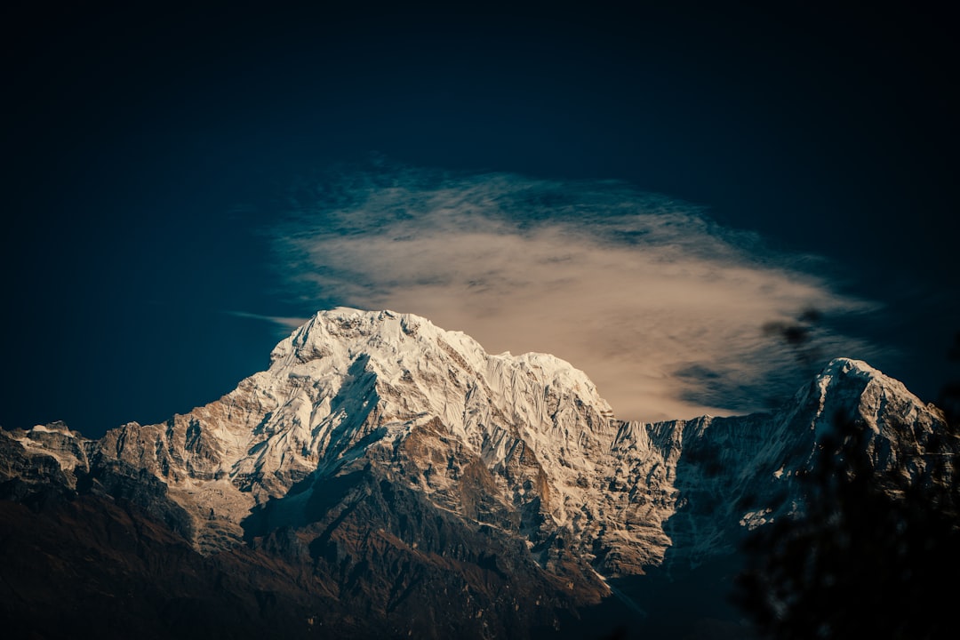 snow covered mountain under blue sky