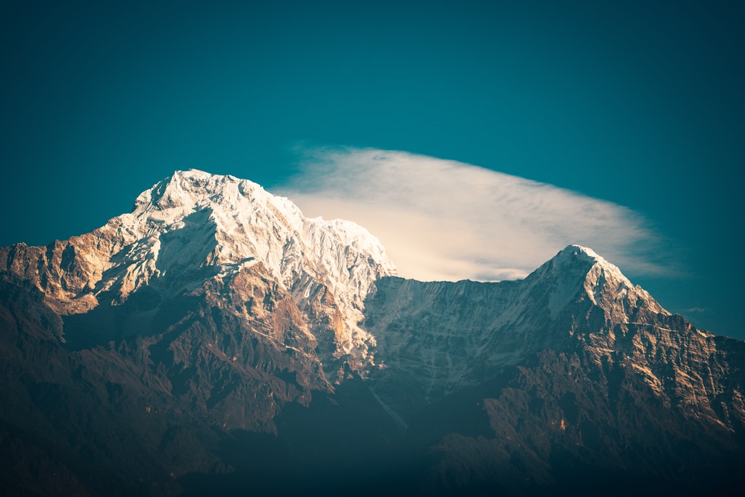 snow covered mountain under blue sky during daytime