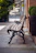 Elegant concrete benches and planters arranged around a cozy patio.