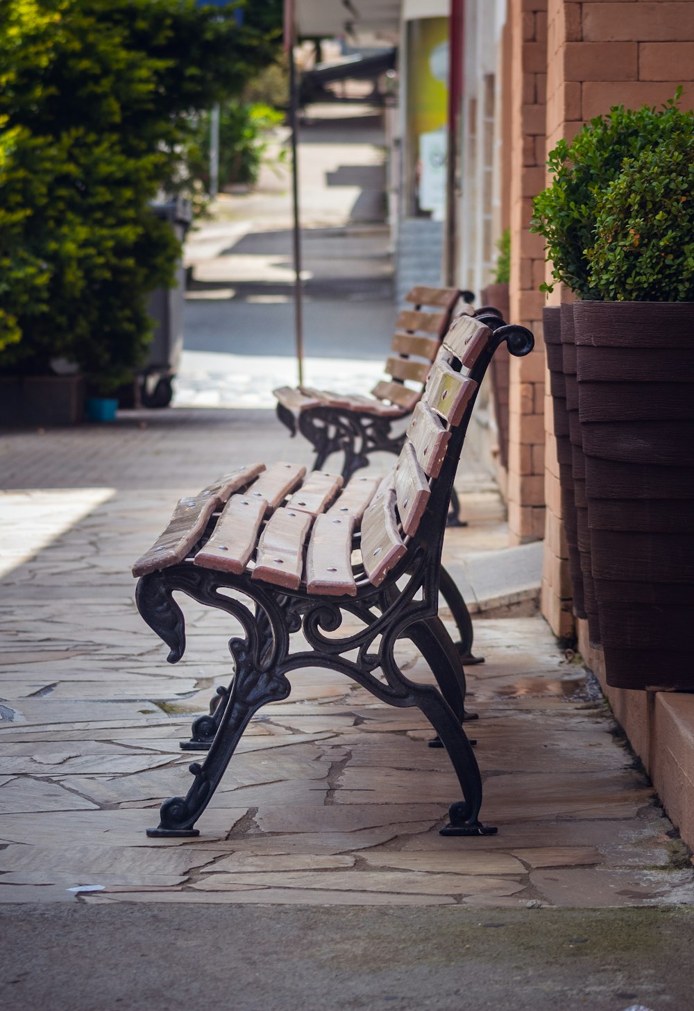 brown wooden bench on gray concrete floor