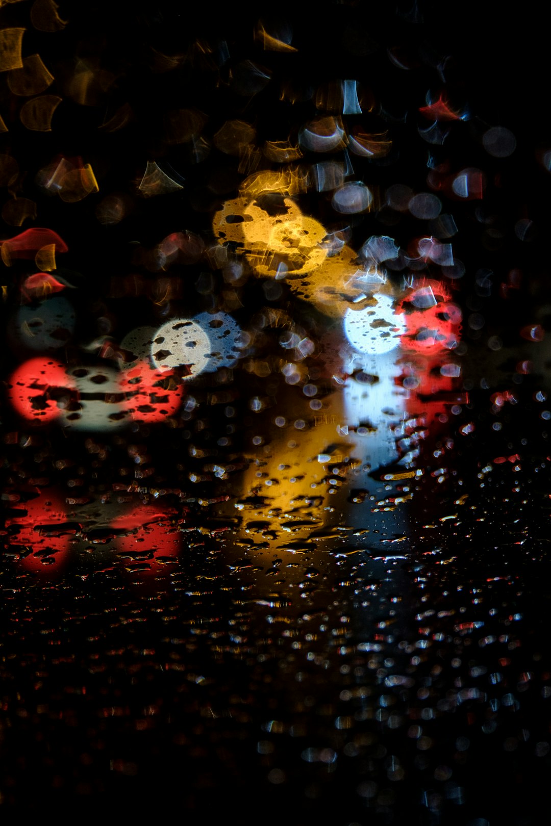 water droplets on glass during night time