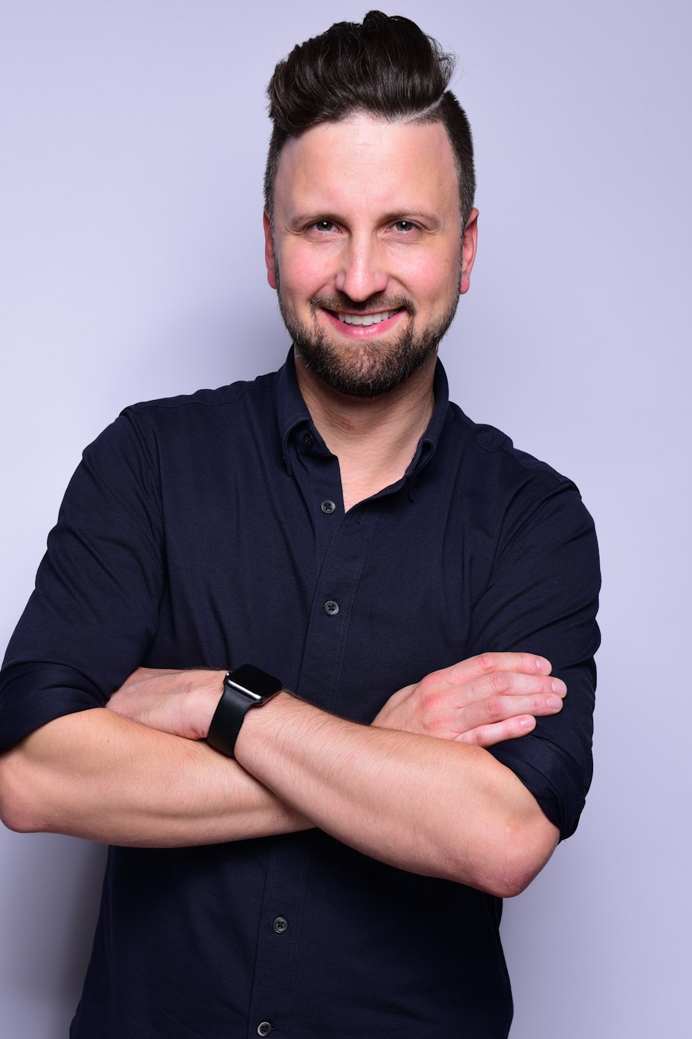 man in black dress shirt wearing black apple watch