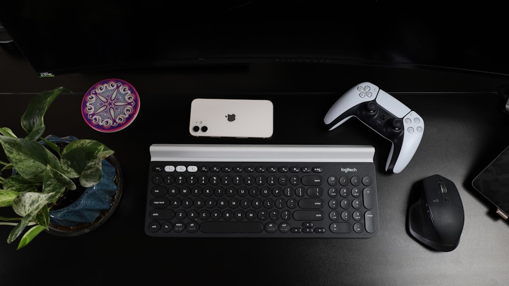 black and silver logitech cordless computer keyboard