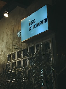 blue and white wooden signage