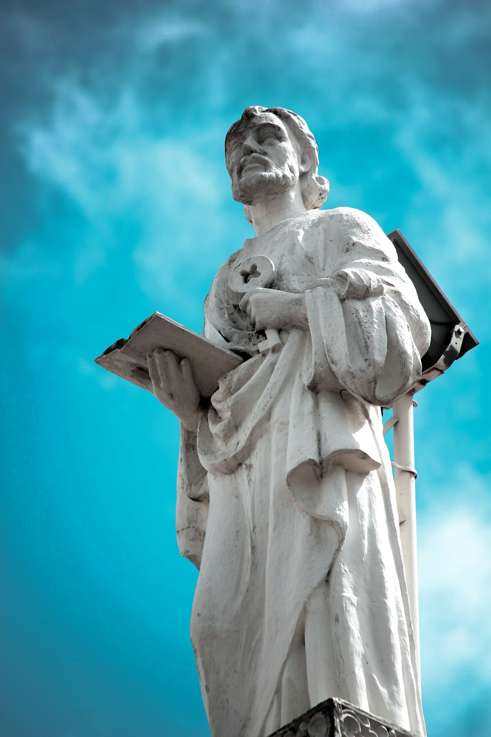 white concrete statue under blue sky during daytime