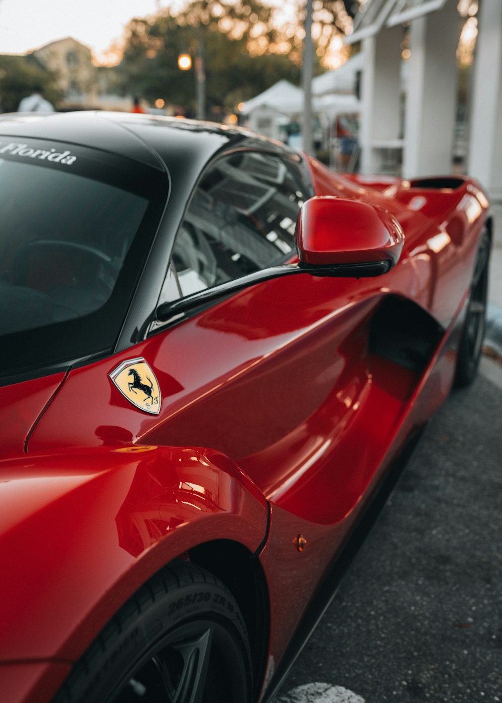 red ferrari 458 italia parked on road during daytime