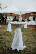 white canopy tent on green grass field during daytime