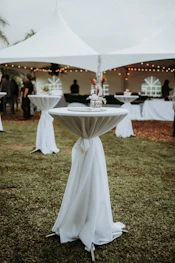white canopy tent on green grass field during daytime
