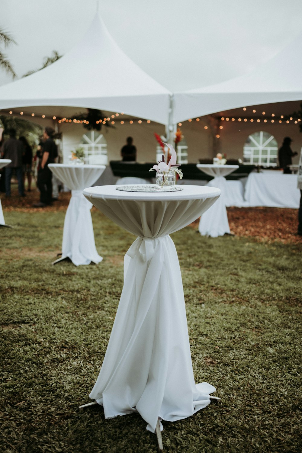 white canopy tent on green grass field during daytime