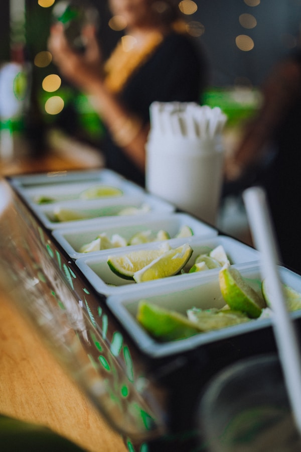 Sliced cucumber on green plastic tray