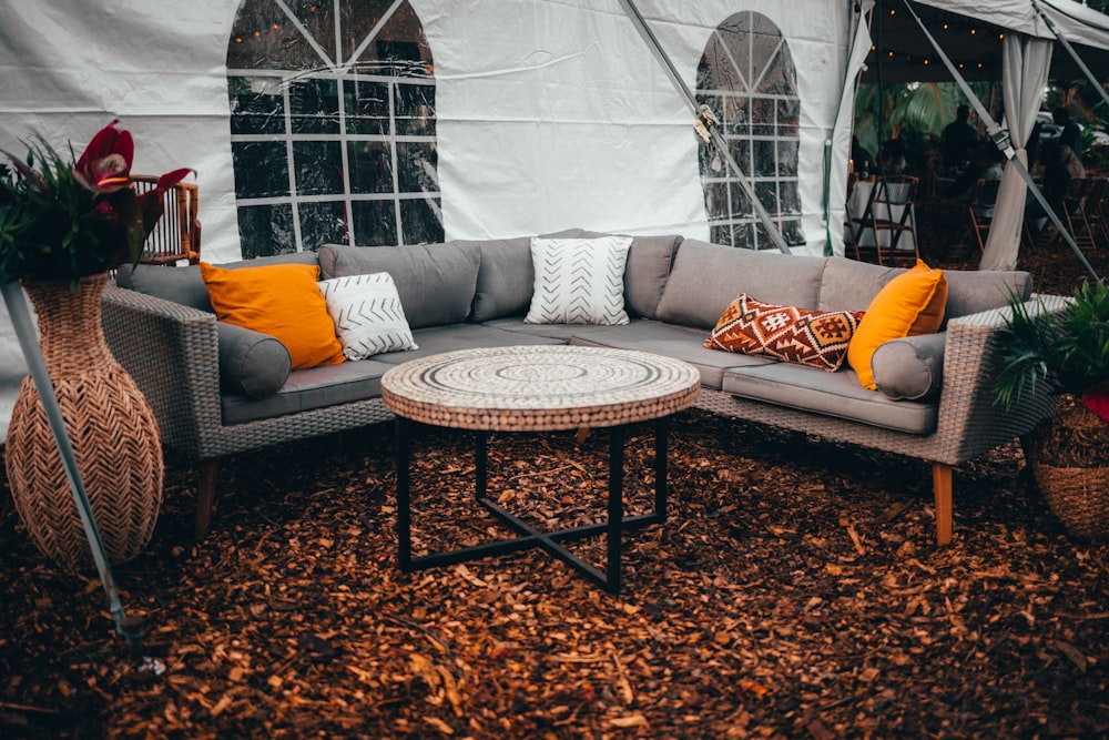 brown wooden coffee table near white couch