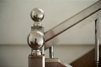 Close-up of a sleek metal staircase railing showcasing craftsmanship.
