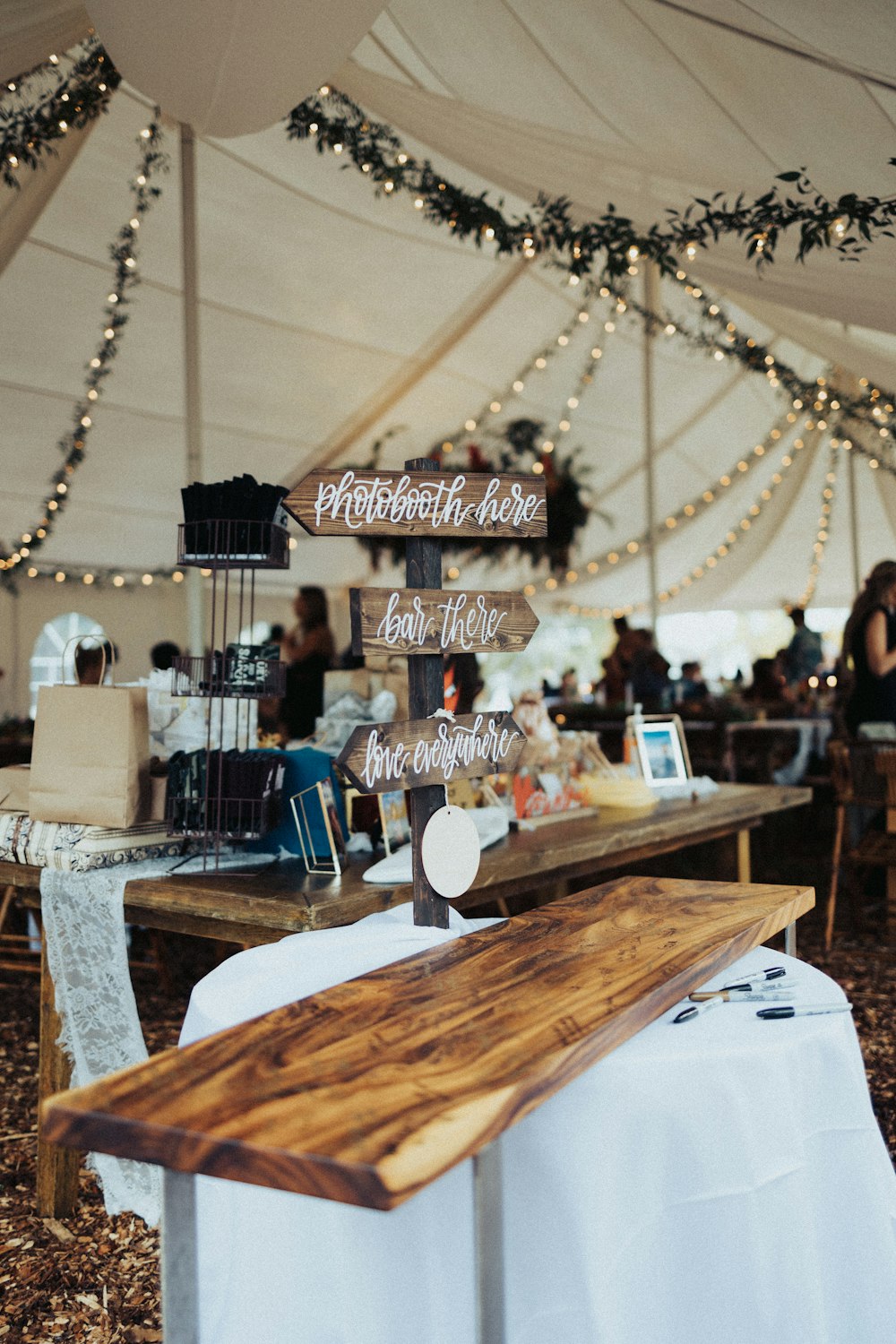 brown wooden table with white table cloth and blue chair