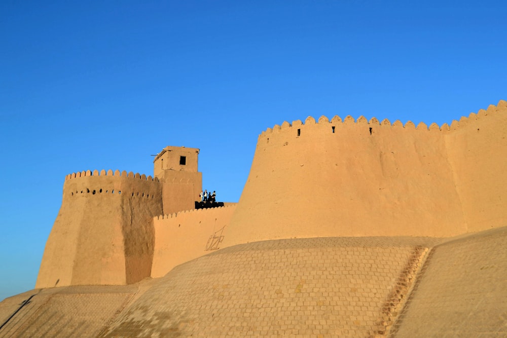 brown concrete building under blue sky during daytime