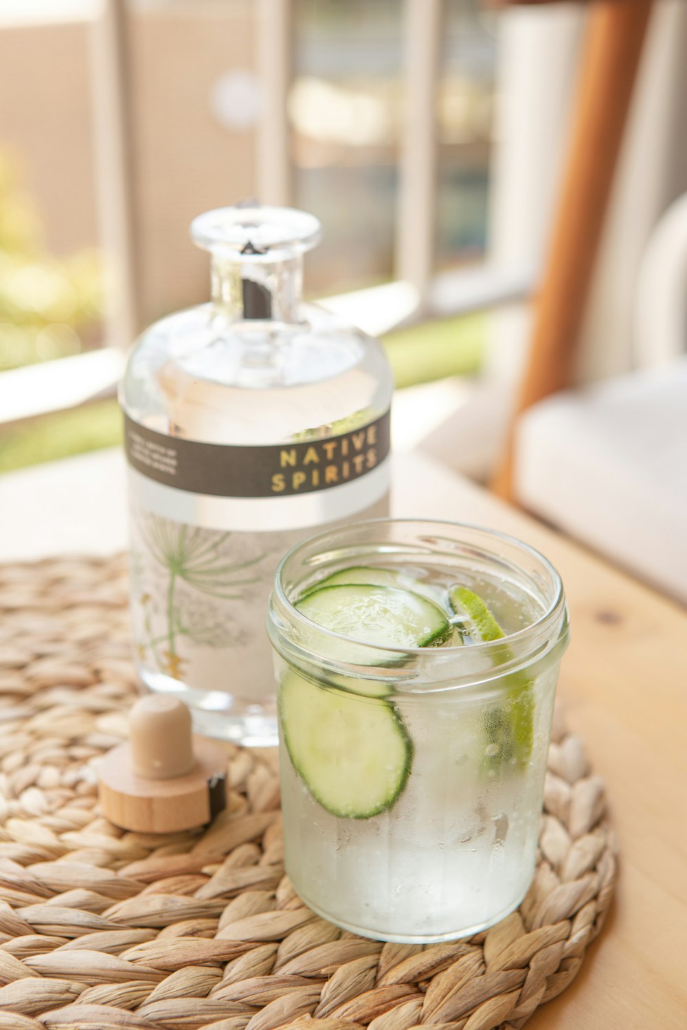 clear drinking glass with green liquid inside