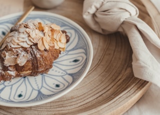 brown bread on white and blue ceramic plate