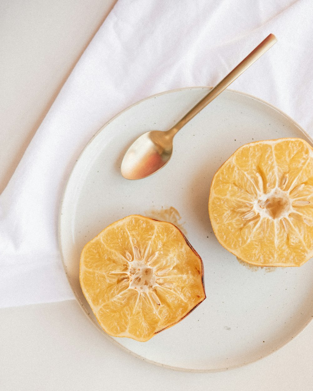 sliced lemon on white ceramic plate