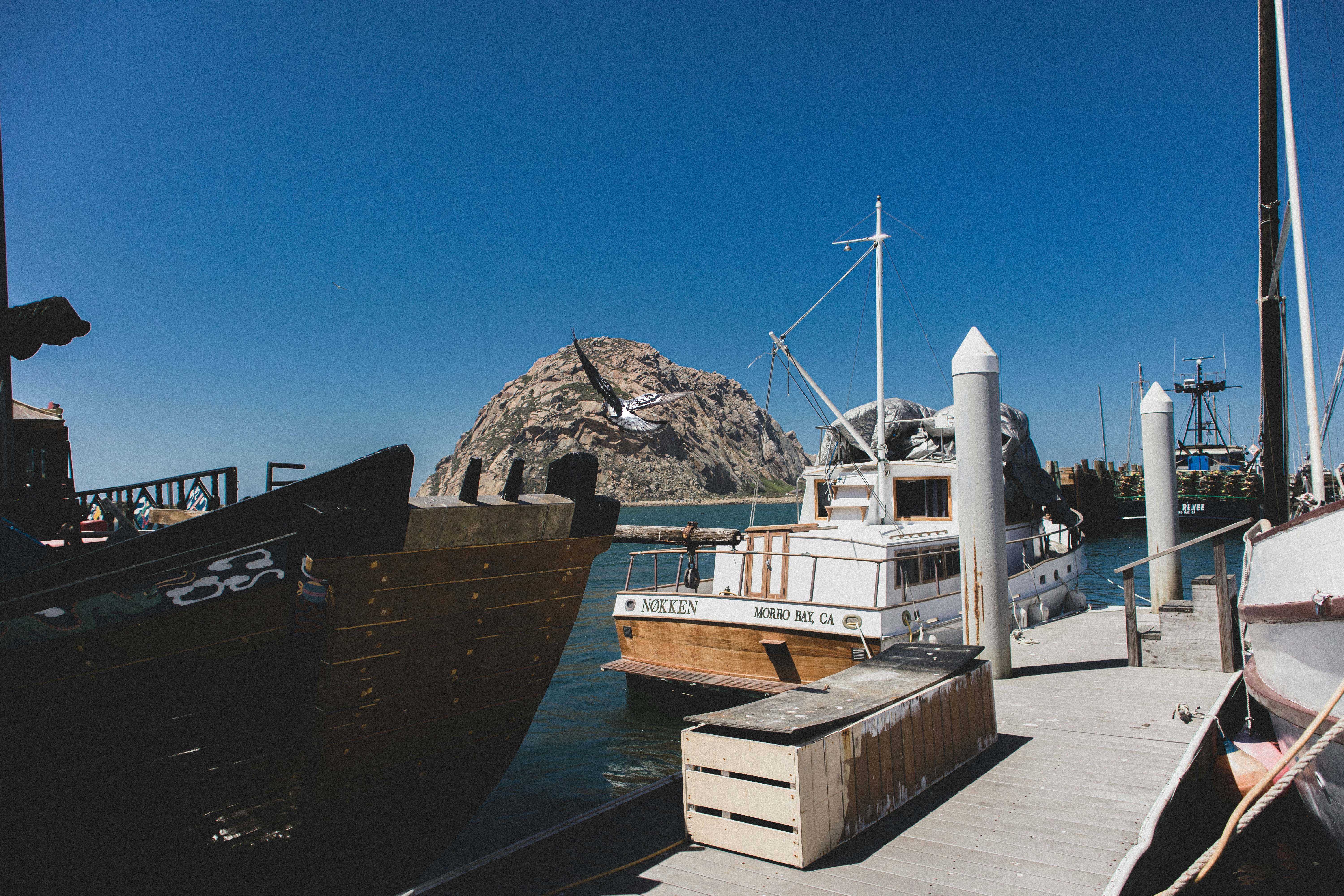 black ship on dock during daytime