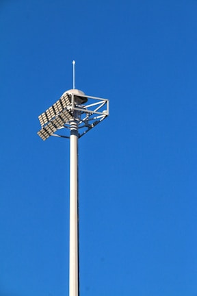 white and black basketball hoop under blue sky during daytime