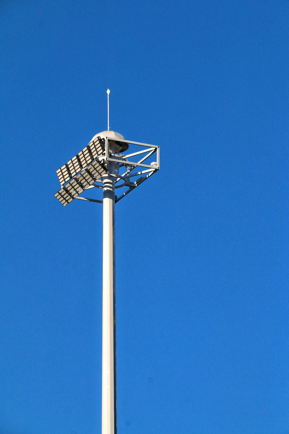 white and black basketball hoop under blue sky during daytime