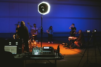 man in black suit playing electric guitar