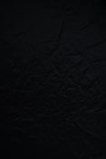 black textile on brown wooden table