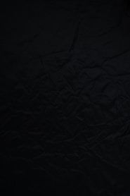 black textile on brown wooden table