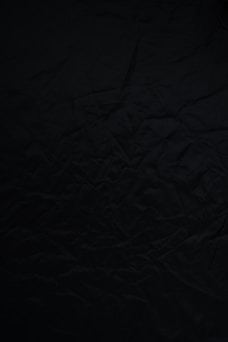 black textile on brown wooden table