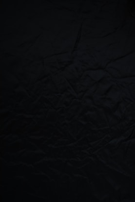black textile on brown wooden table