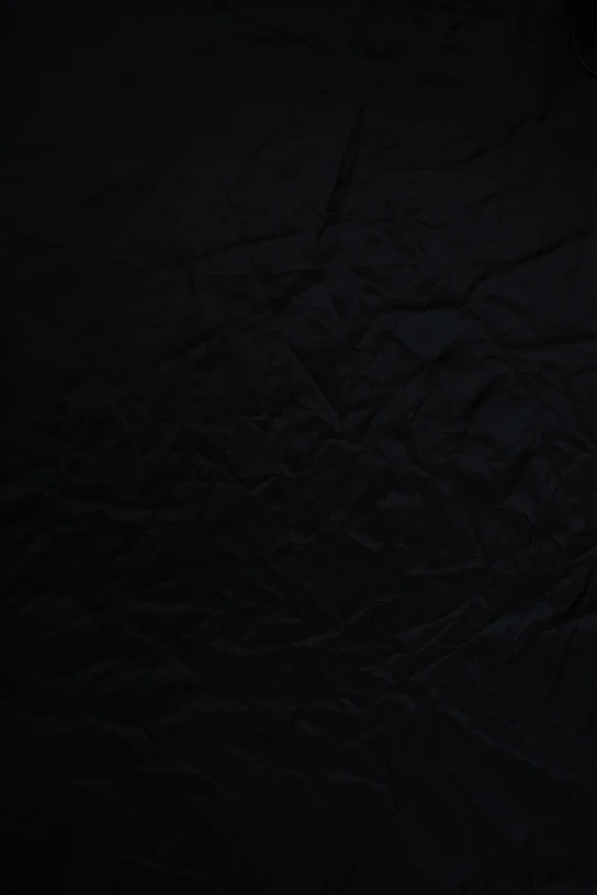 black textile on brown wooden table