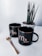 black and white ceramic mug