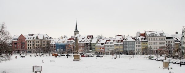 The Domplatz in winter, where the market stands under the cathedral steps — Erfurt, Germany